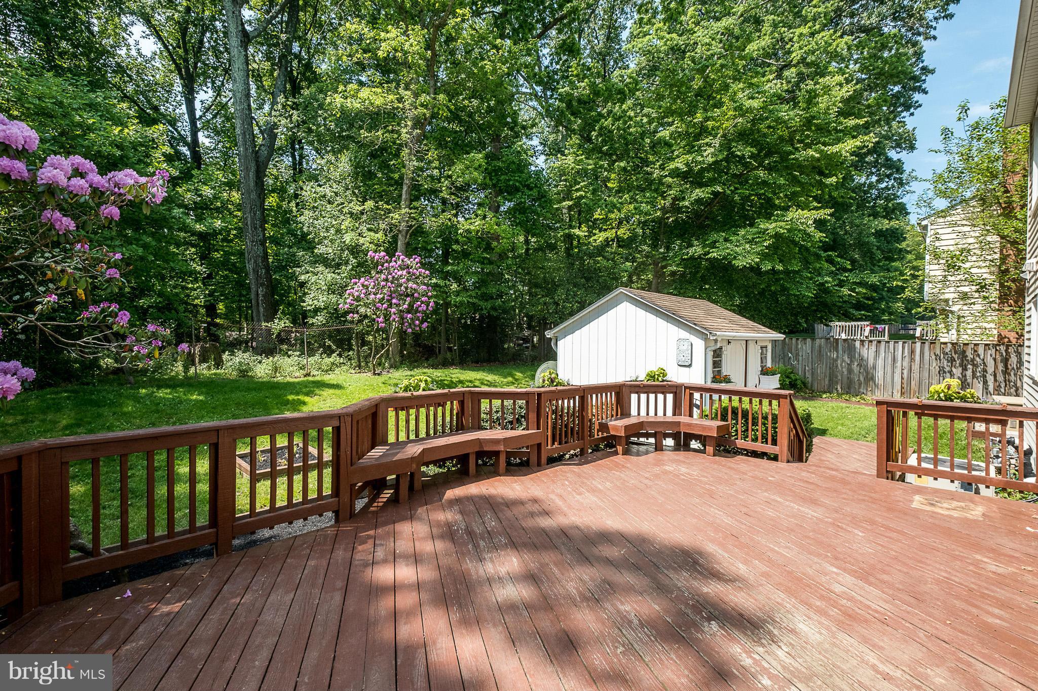 1412 Winding Waye Lane Silver Spring, MD 20902 - Photo 23 of 30 a view of a house with wooden deck and a backyard
