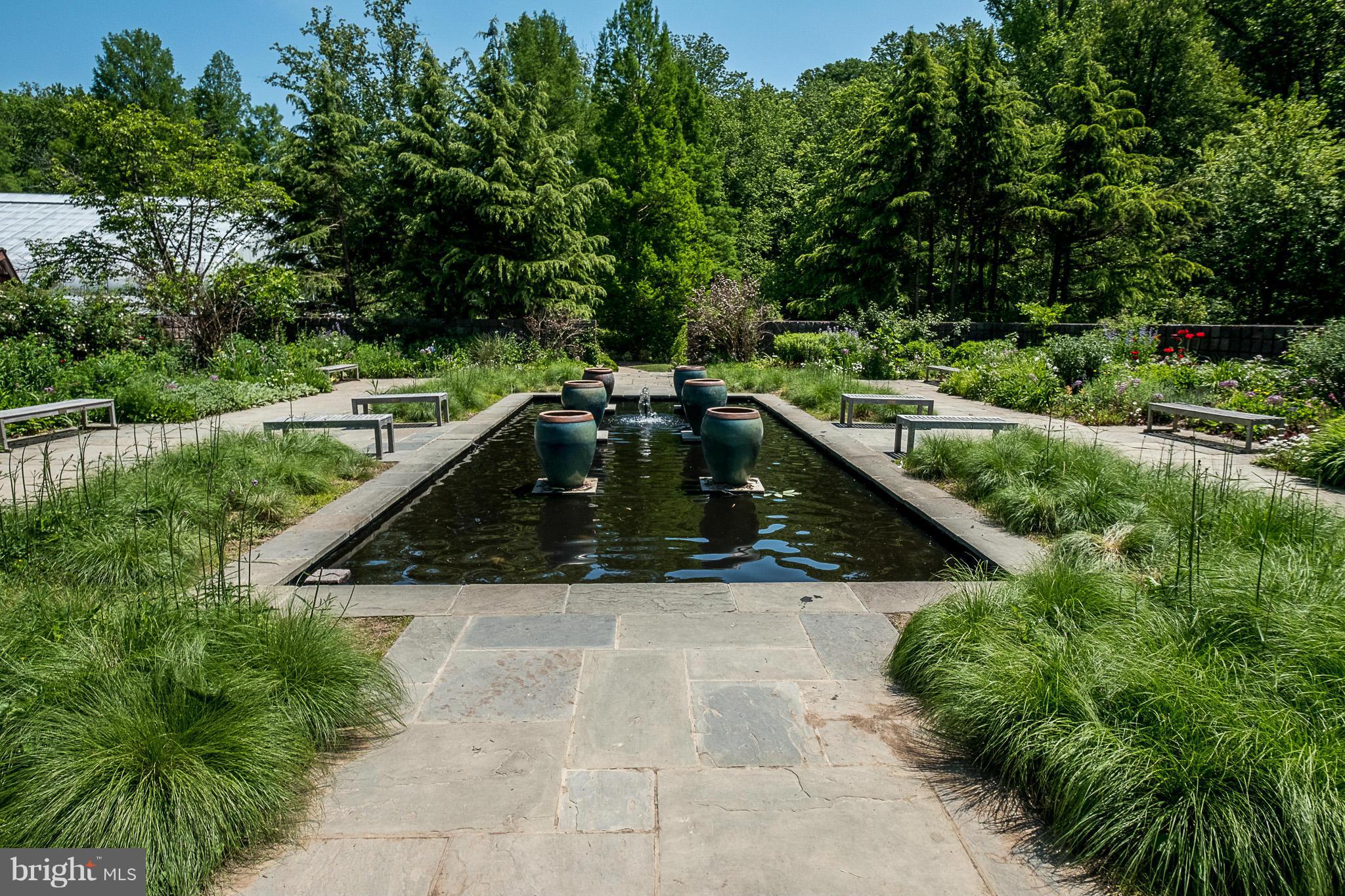 1412 Winding Waye Lane Silver Spring, MD 20902 - Photo 29 of 30 a view of a swimming pool with a garden