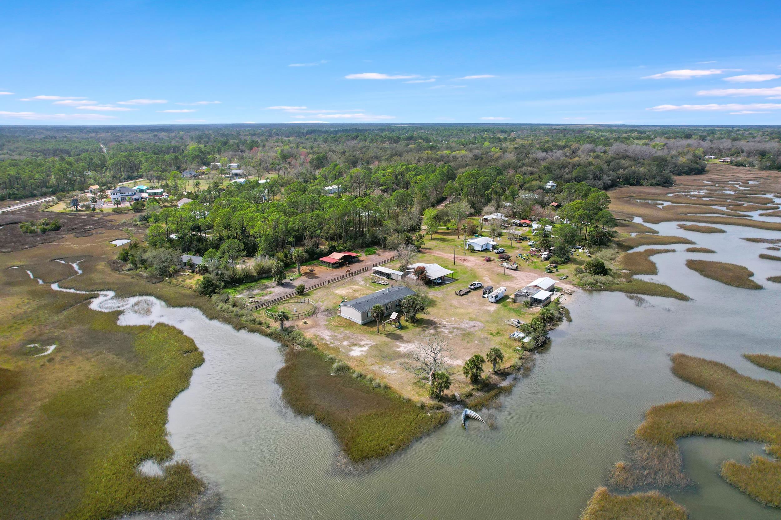 490 Coopers Cove Road St. Augustine, FL 32095 - Photo 3 of 13 a view of a lake with outdoor space