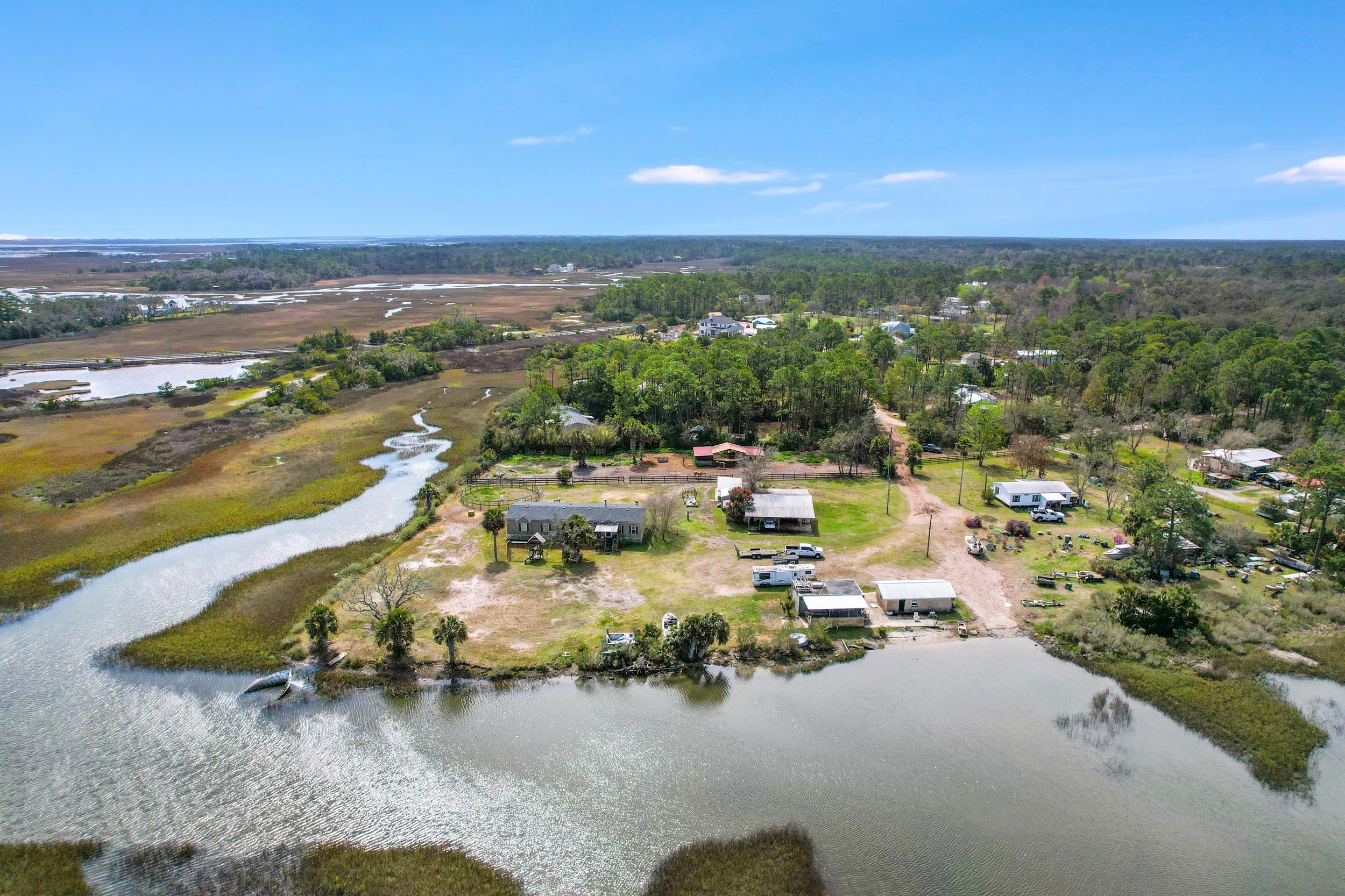 490 Coopers Cove Road St. Augustine, FL 32095 - Photo 4 of 13 an aerial view of residential houses with outdoor space