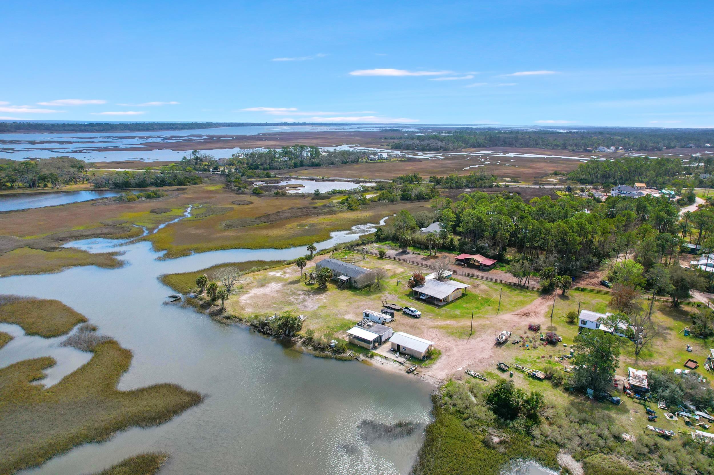 490 Coopers Cove Road St. Augustine, FL 32095 - Photo 8 of 13 a view of a lake with a city