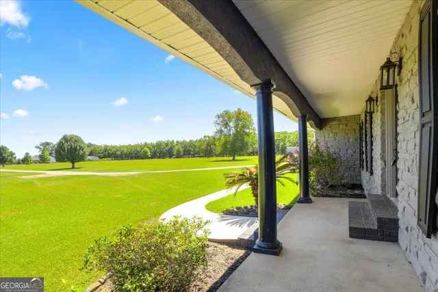 a view of a hallway with wooden shelves