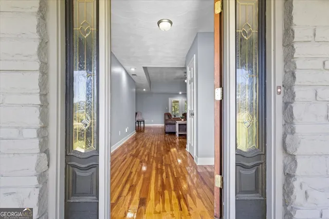 a spacious bathroom with a sink double vanity next to a window