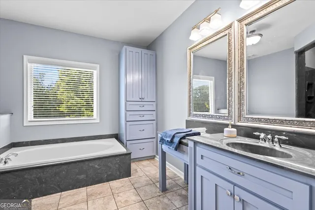 a view of a swimming pool with an outdoor space and seating area