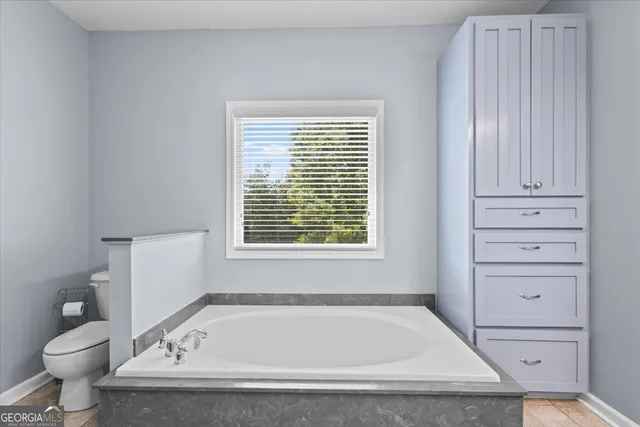 a view of a lake with a yard