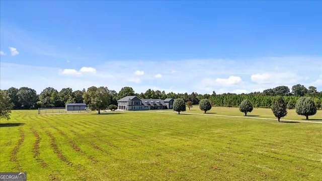 a kitchen with stainless steel appliances a stove sink and microwave