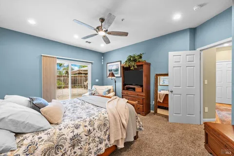 a bathroom with a sink a toilet a mirror and shower