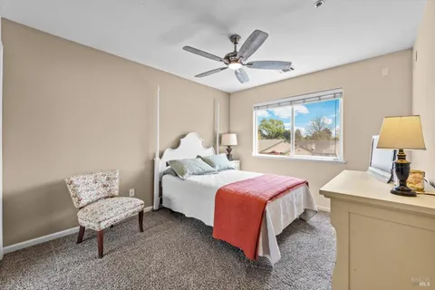 a bedroom with bed and window