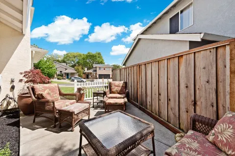 an aerial view of a house with outdoor space