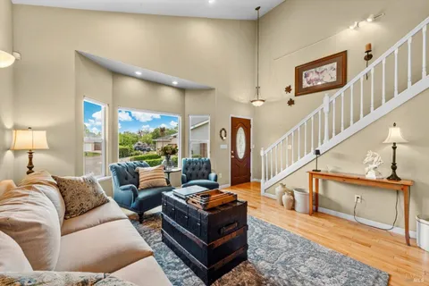 a living room with furniture and a table