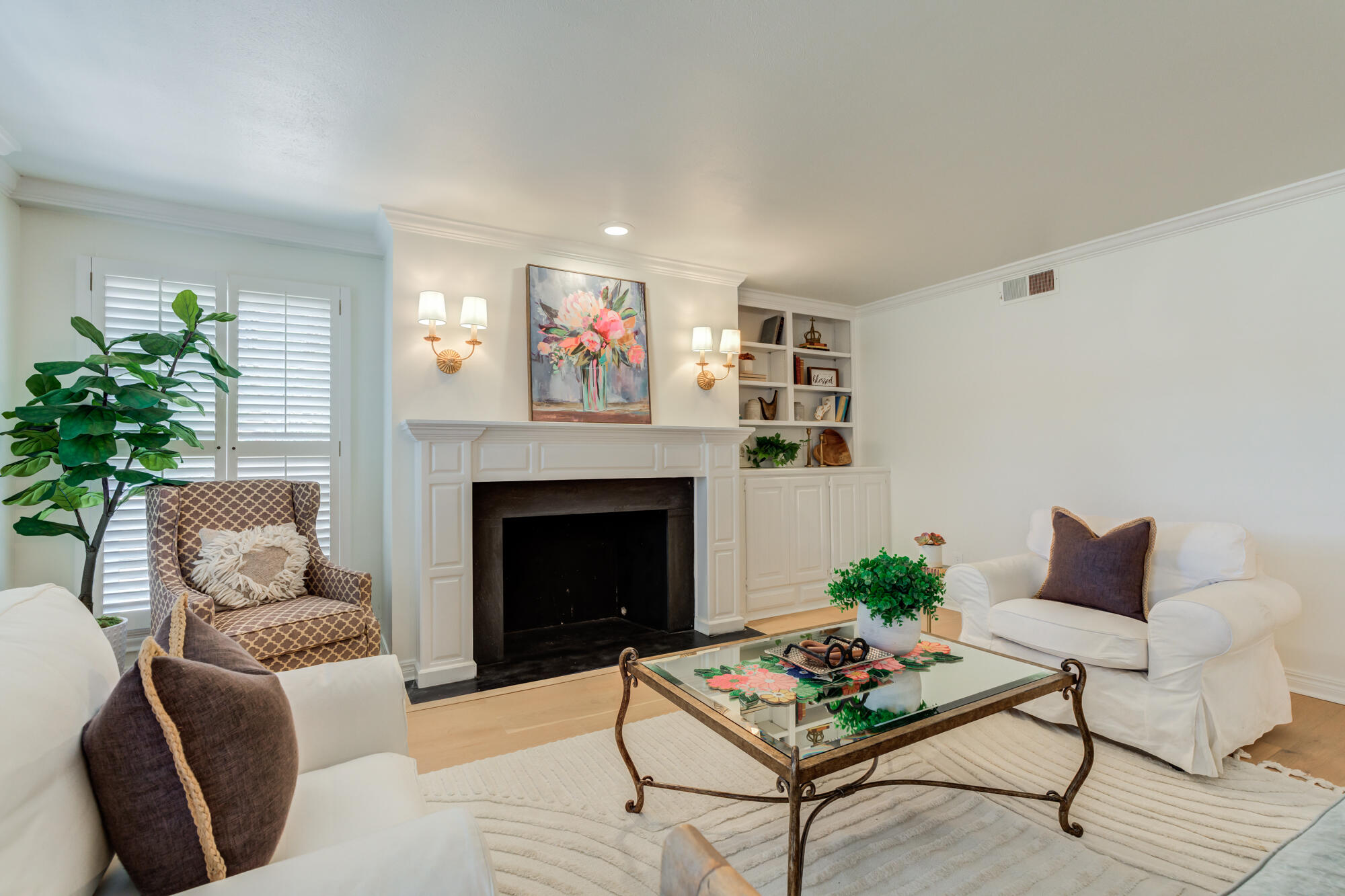 4407 13th Street Lubbock, TX 79416 - Photo 11 of 88 a living room with furniture and a fireplace
