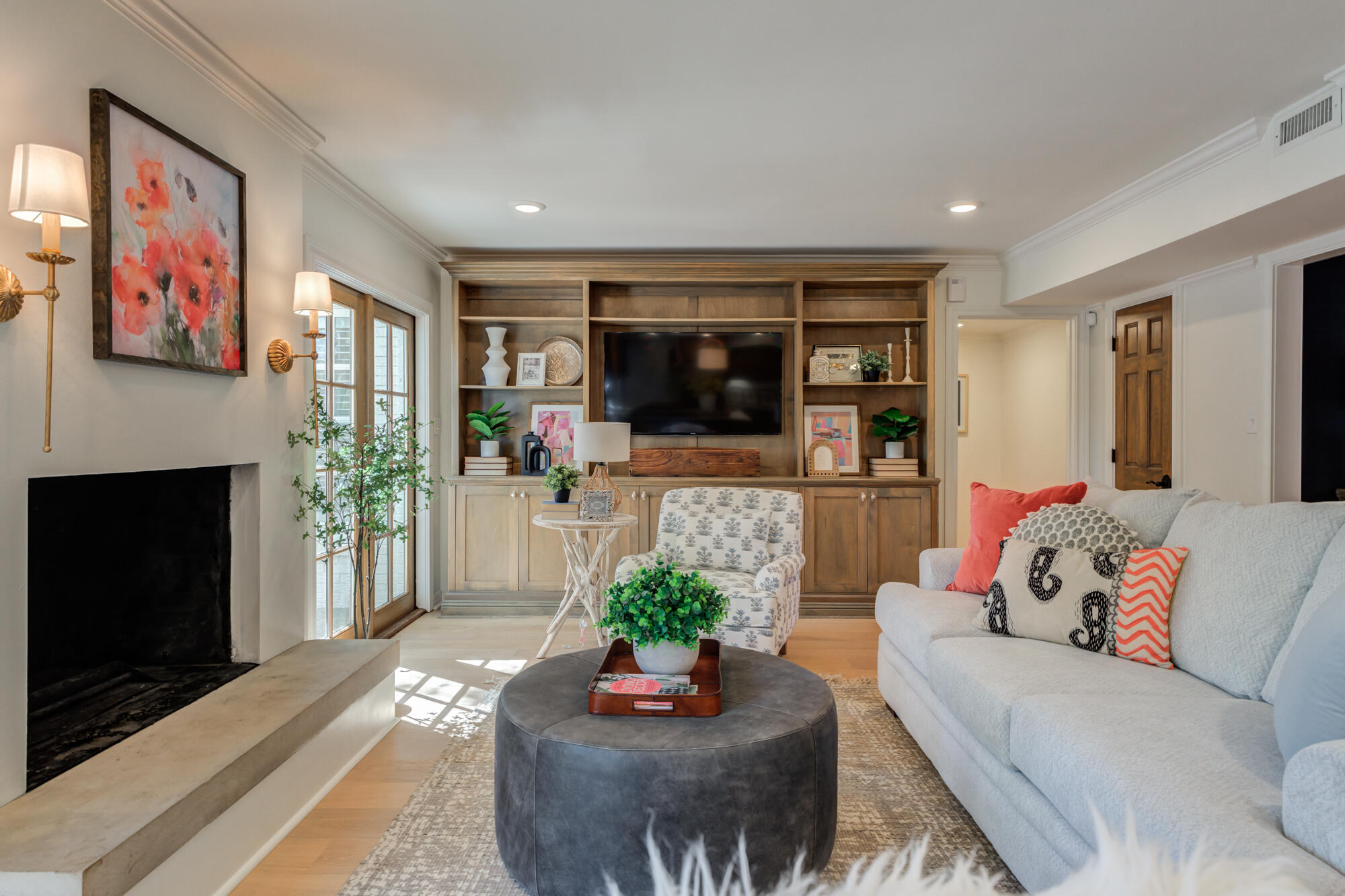 4407 13th Street Lubbock, TX 79416 - Photo 20 of 88 a living room with furniture a flat screen tv and a fireplace