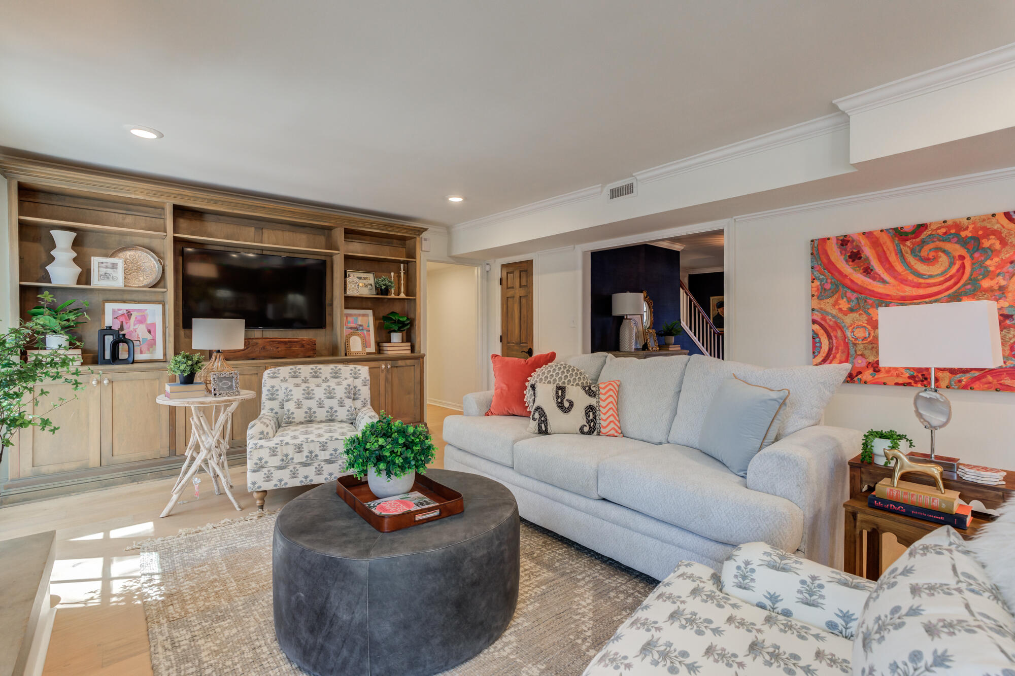 4407 13th Street Lubbock, TX 79416 - Photo 21 of 88 a living room with furniture and a flat screen tv