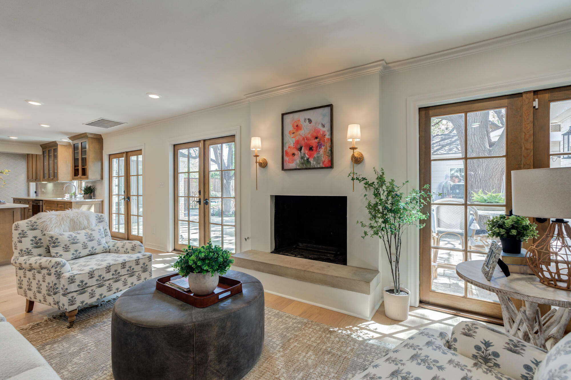 4407 13th Street Lubbock, TX 79416 - Photo 23 of 88 a living room with furniture a large window and a flat screen tv