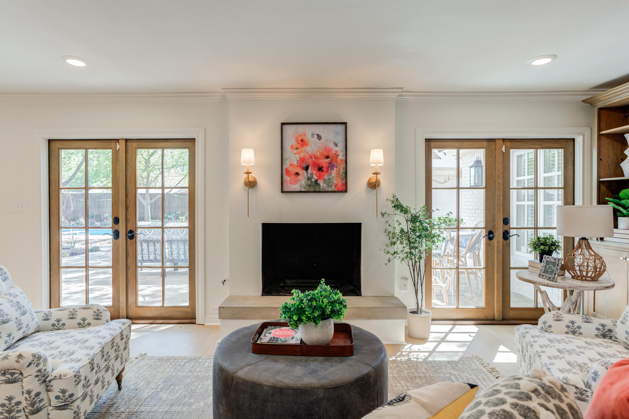 4407 13th Street Lubbock, TX 79416 - Photo 24 of 88 a living room with furniture large window and a fireplace
