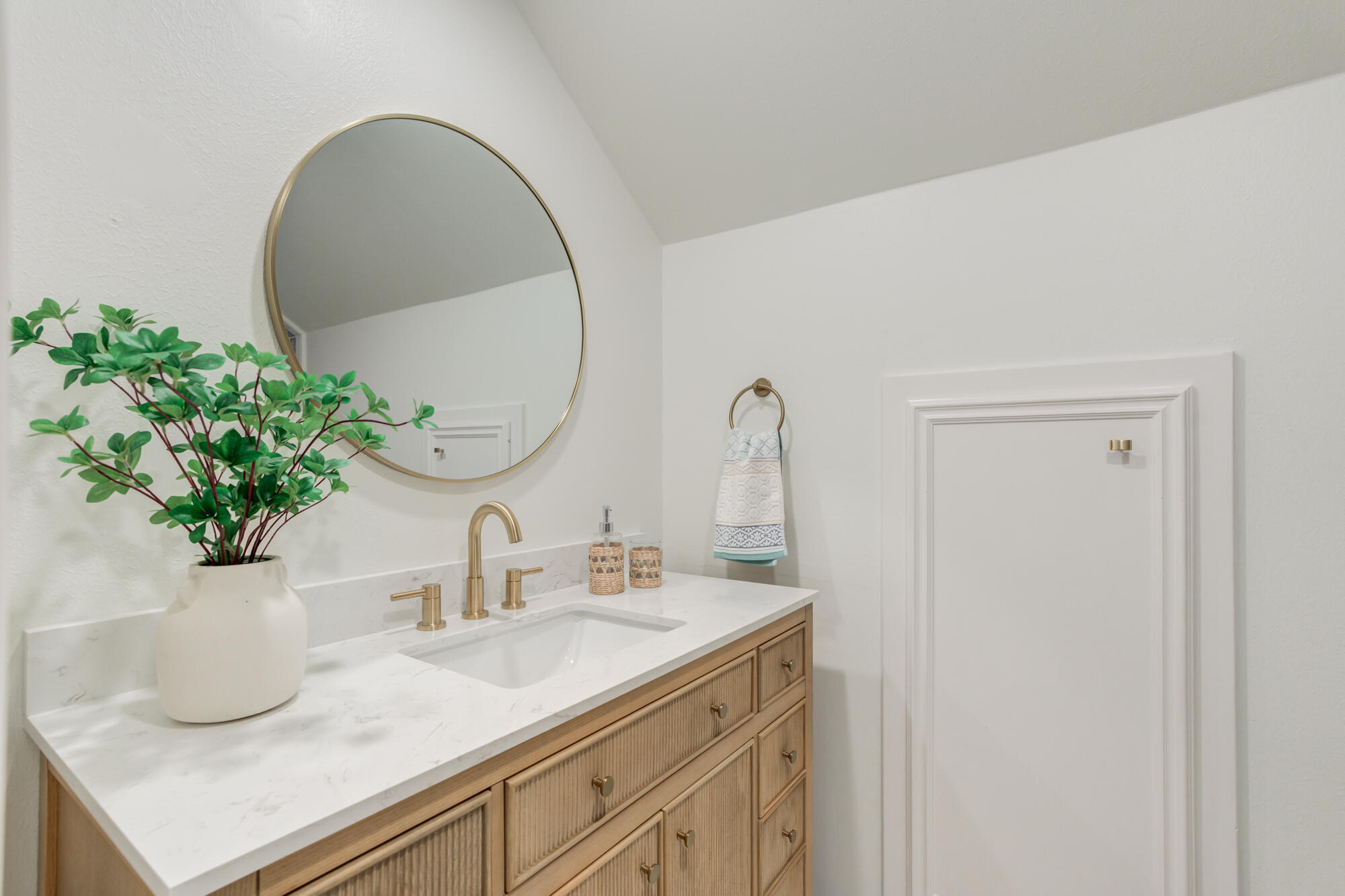 4407 13th Street Lubbock, TX 79416 - Photo 62 of 88 a bathroom with a sink and a mirror