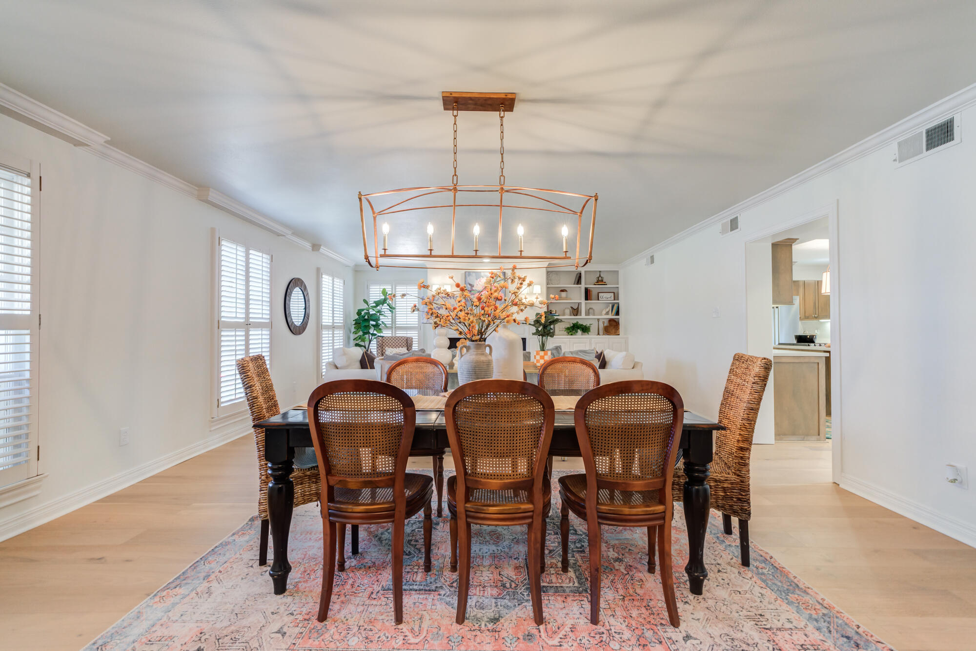 4407 13th Street Lubbock, TX 79416 - Photo 7 of 88 a view of a dining room with furniture and chandelier
