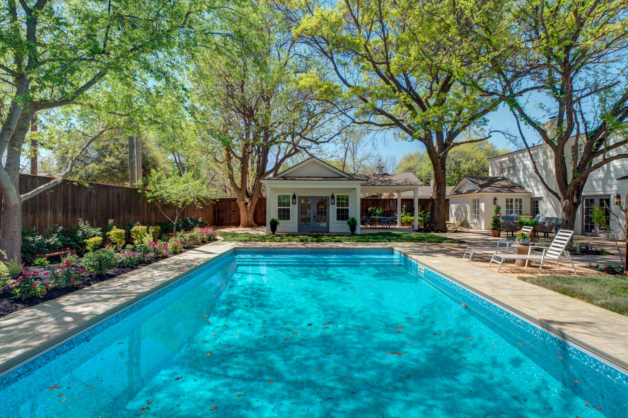 4407 13th Street Lubbock, TX 79416 - Photo 74 of 88 a front view of a house with swimming pool having outdoor seating