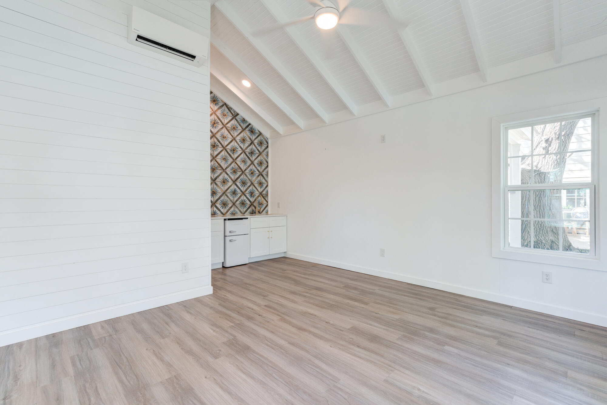 4407 13th Street Lubbock, TX 79416 - Photo 81 of 88 wooden floor in an empty room with a window