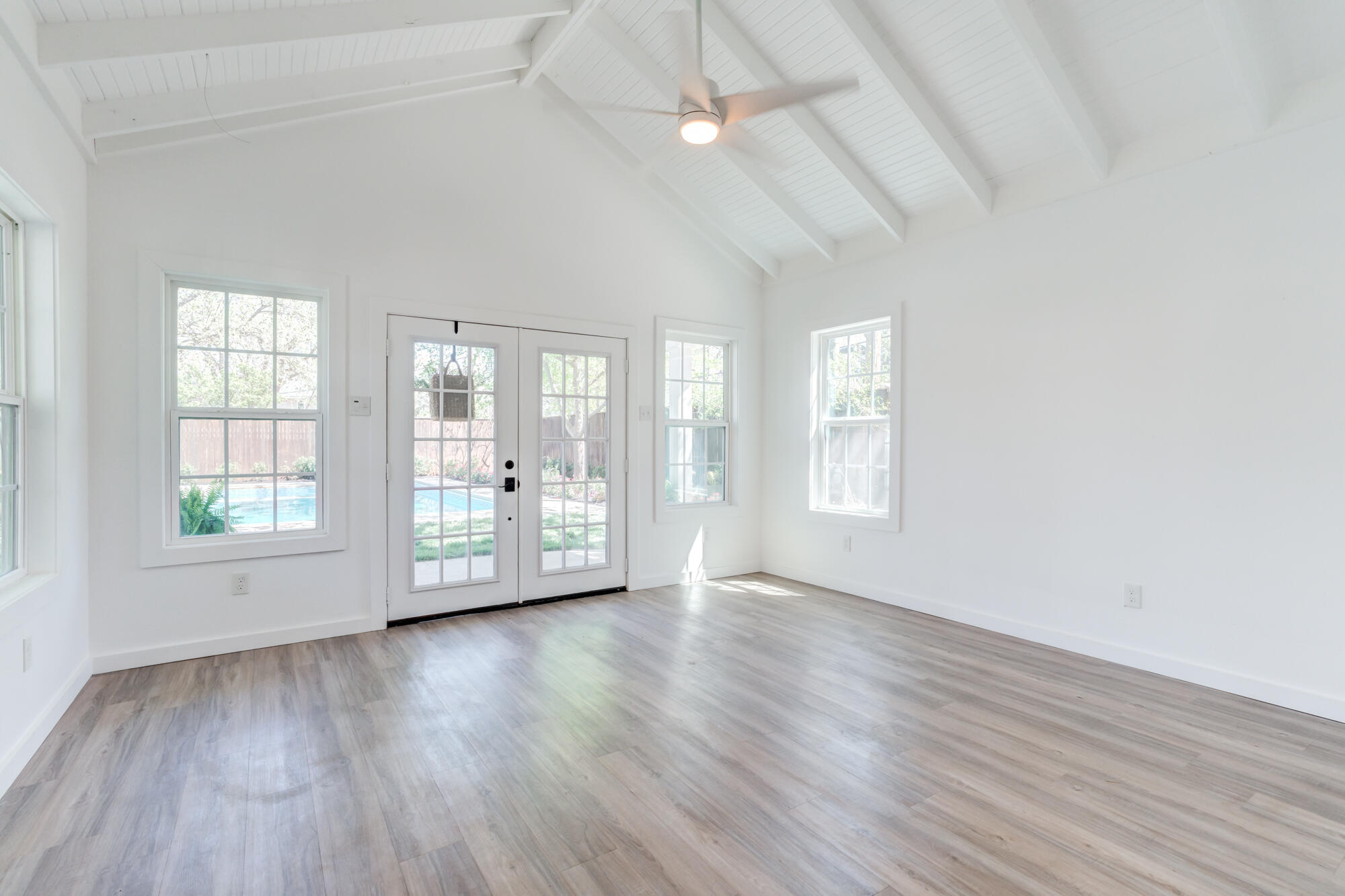 4407 13th Street Lubbock, TX 79416 - Photo 87 of 88 an empty room with wooden floor and windows