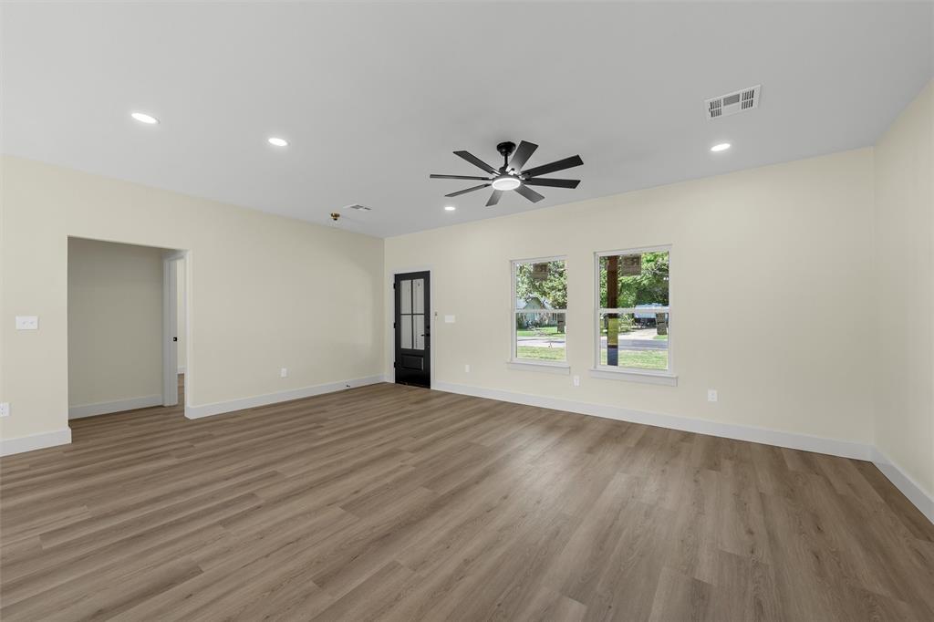 3320 North 27th Street Waco, TX 76708 - Photo 17 of 38 a view of an empty room with a window and wooden floor