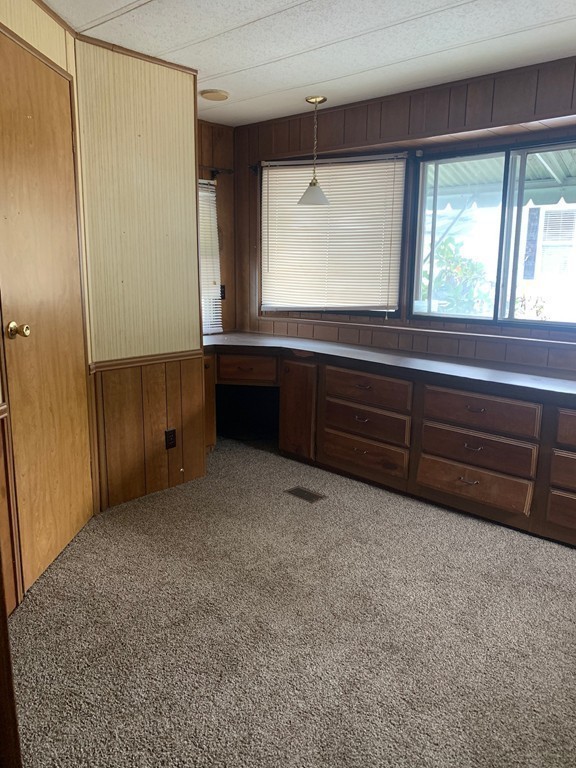 83 Clark Road, Unit 65 Shirley, MA 01464 - Photo 15 of 15 a room with window and cabinet