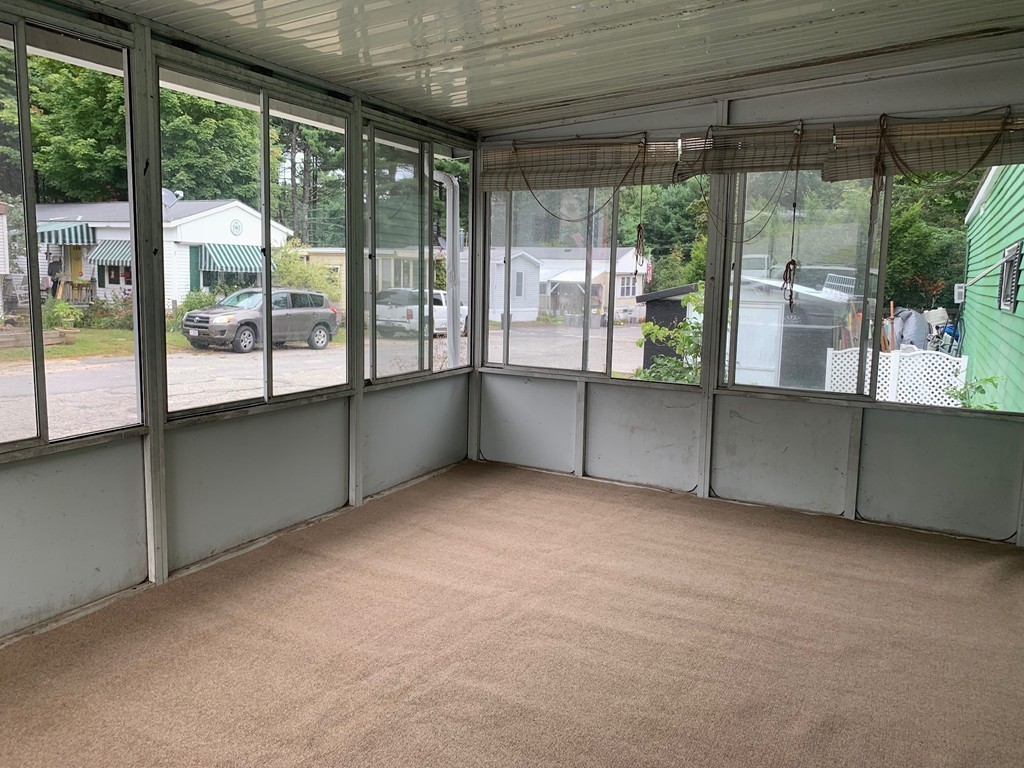 83 Clark Road, Unit 65 Shirley, MA 01464 - Photo 7 of 15 an empty room with windows