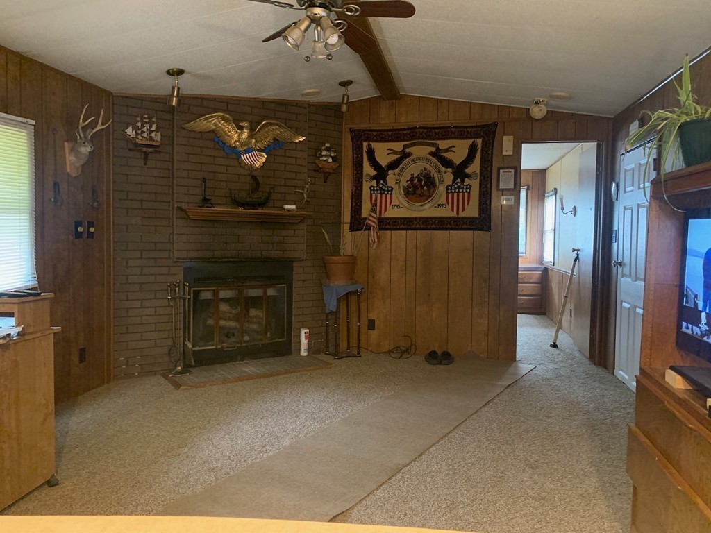 83 Clark Road, Unit 65 Shirley, MA 01464 - Photo 8 of 15 a view of a livingroom with a fireplace