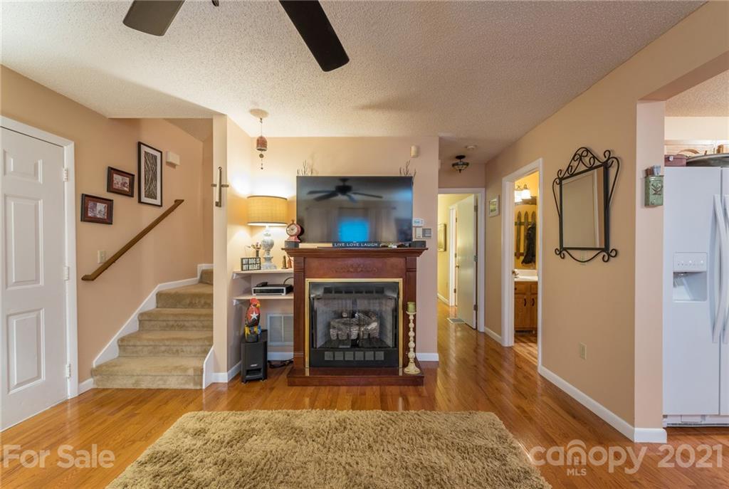 31 Bear Trail Fairview, NC 28730 - Photo 14 of 48 a living room with furniture and a fireplace