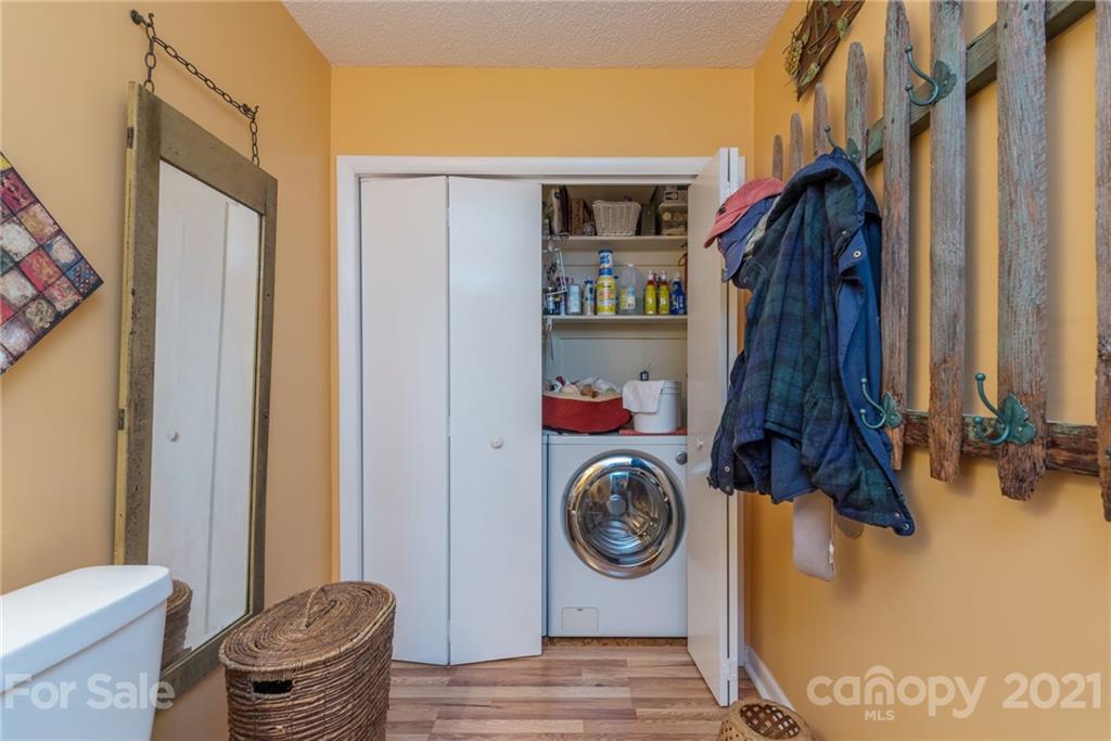 31 Bear Trail Fairview, NC 28730 - Photo 16 of 48 a view of walk in closet with clothes and shoes