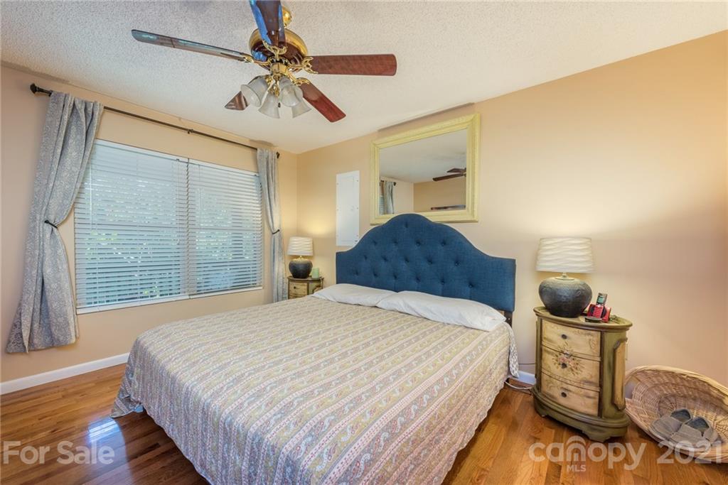 31 Bear Trail Fairview, NC 28730 - Photo 17 of 48 a bedroom with a bed and dresser