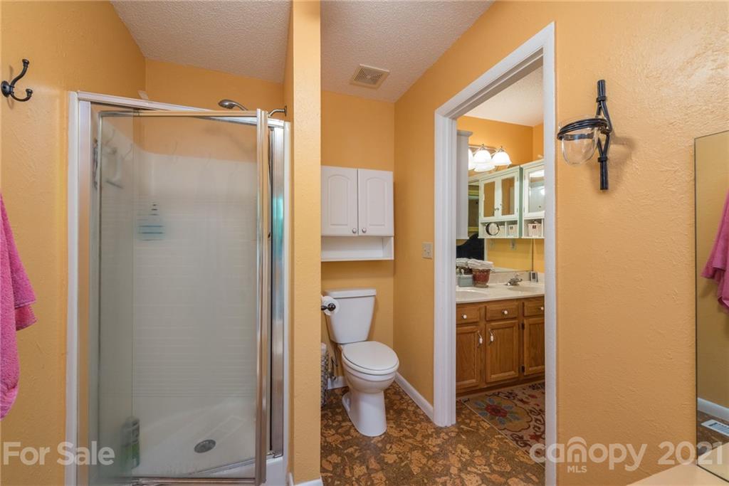 31 Bear Trail Fairview, NC 28730 - Photo 20 of 48 a bathroom with a shower and a toilet