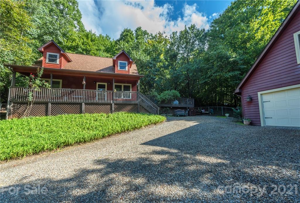 31 Bear Trail Fairview, NC 28730 - Photo 3 of 48 a front view of a house with a yard