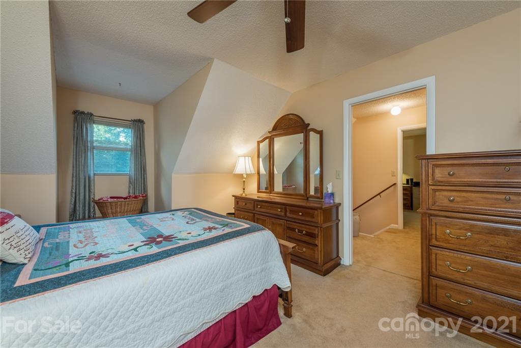 31 Bear Trail Fairview, NC 28730 - Photo 25 of 48 a bedroom with a bed and a dresser