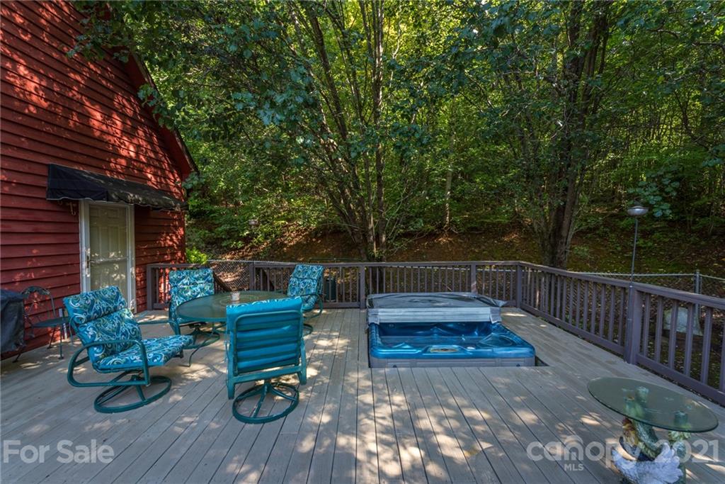 31 Bear Trail Fairview, NC 28730 - Photo 31 of 48 a view of a deck with chairs and a potted plant