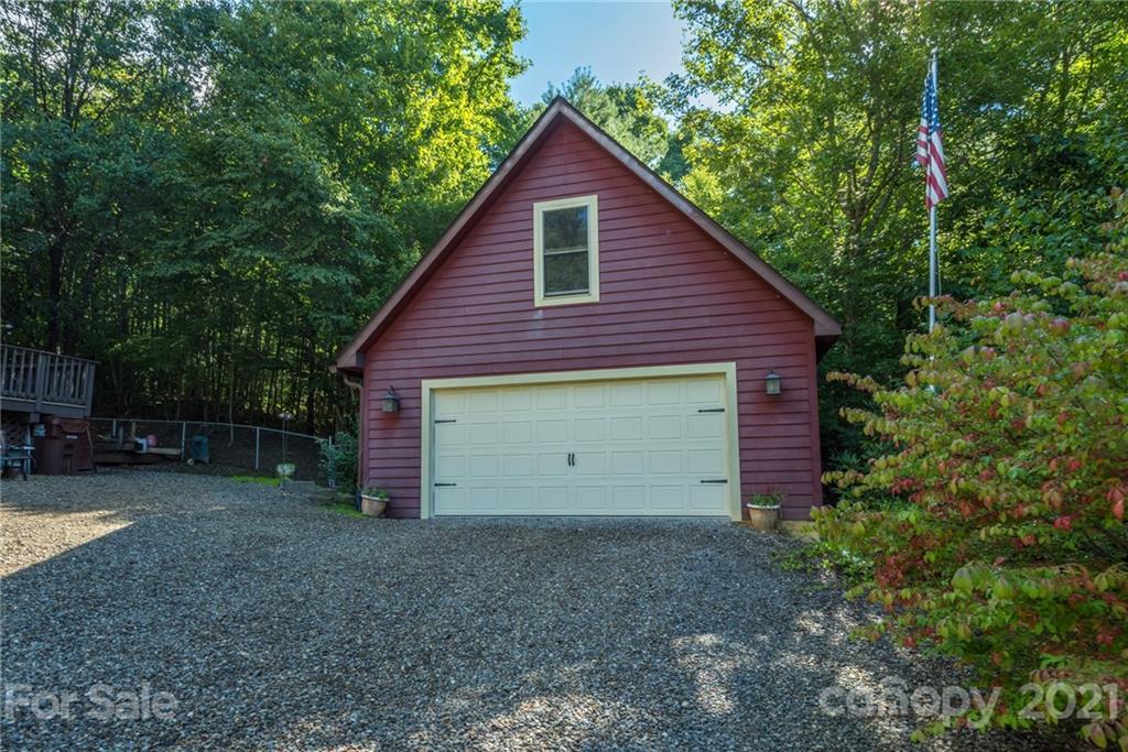 31 Bear Trail Fairview, NC 28730 - Photo 33 of 48 a view of a small house and a yard