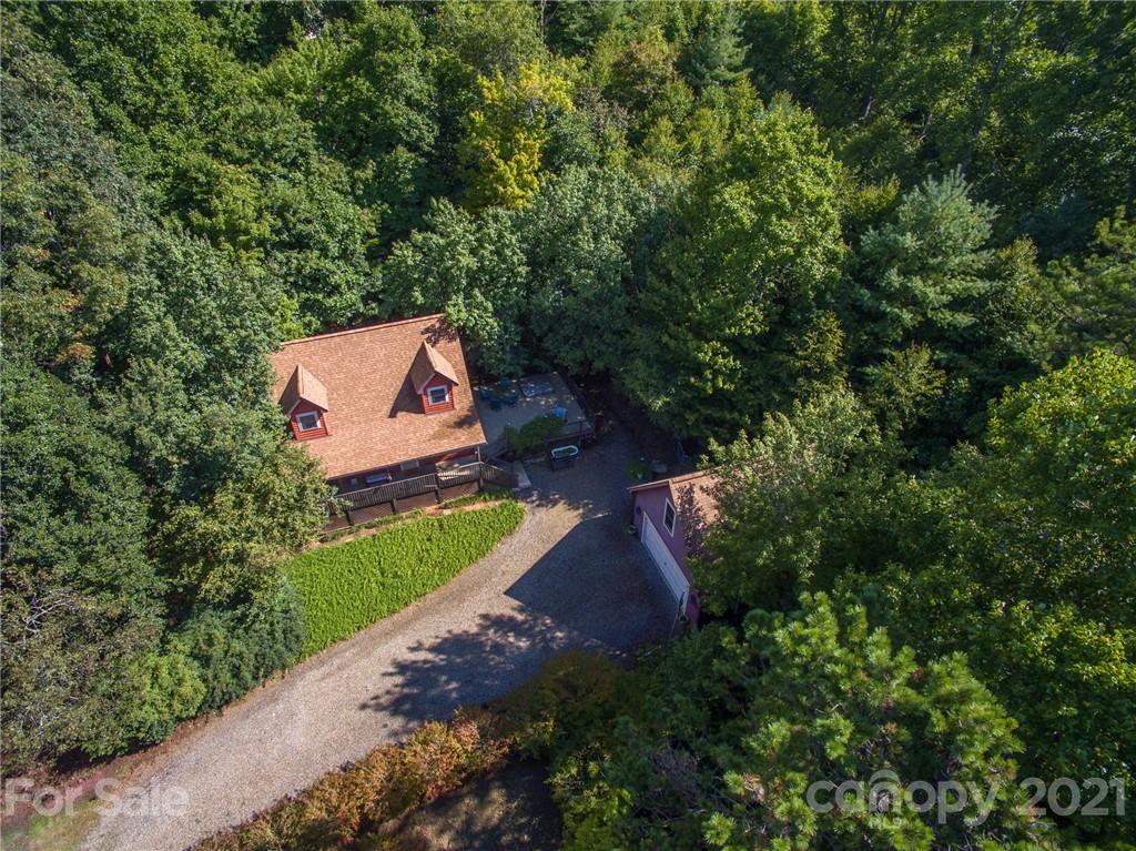 31 Bear Trail Fairview, NC 28730 - Photo 5 of 48 an aerial view of a house with a yard and a large tree