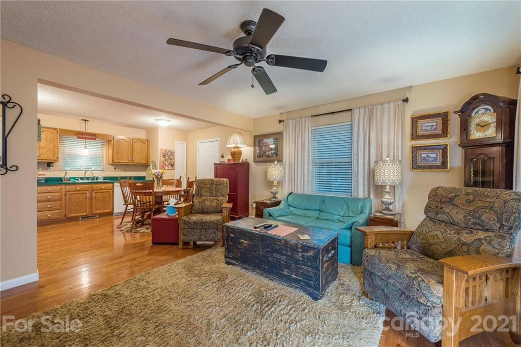 31 Bear Trail Fairview, NC 28730 - Photo 9 of 48 a living room with furniture and a large window