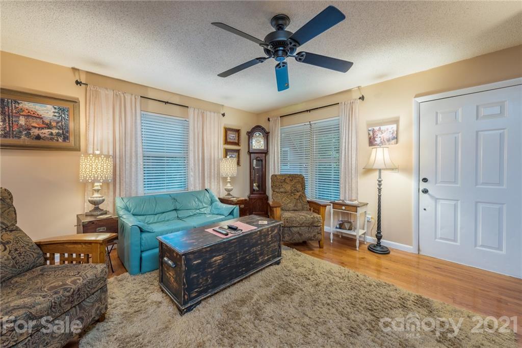 31 Bear Trail Fairview, NC 28730 - Photo 10 of 48 a living room with furniture and a table