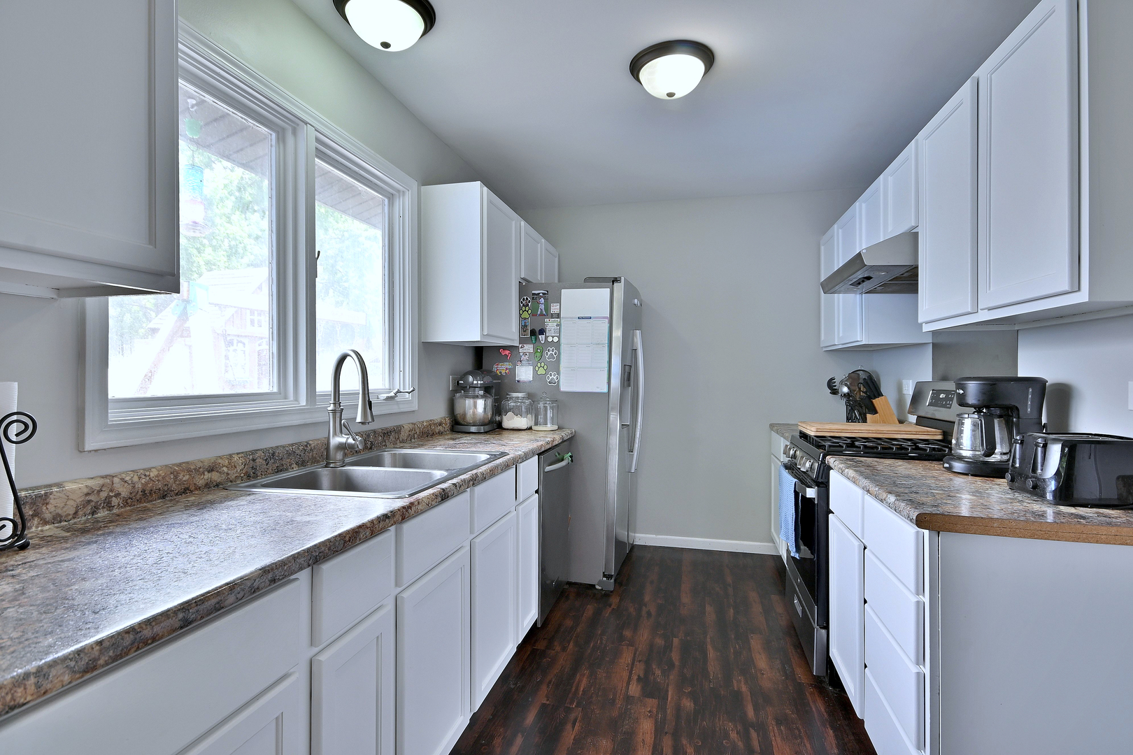 518 Emerson Circle Bolingbrook, IL 60440 - Photo 13 of 29 a kitchen with stainless steel appliances granite countertop a sink stove and refrigerator