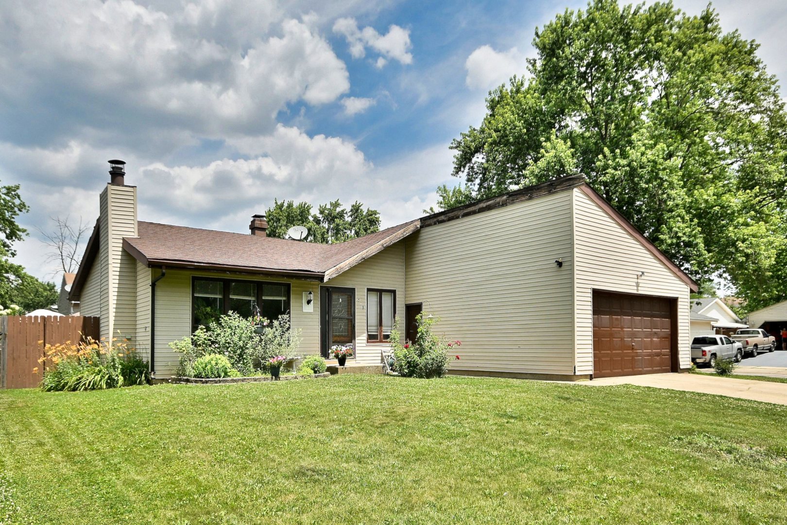 518 Emerson Circle Bolingbrook, IL 60440 - Photo 2 of 29 a backyard of a house with table and chairs