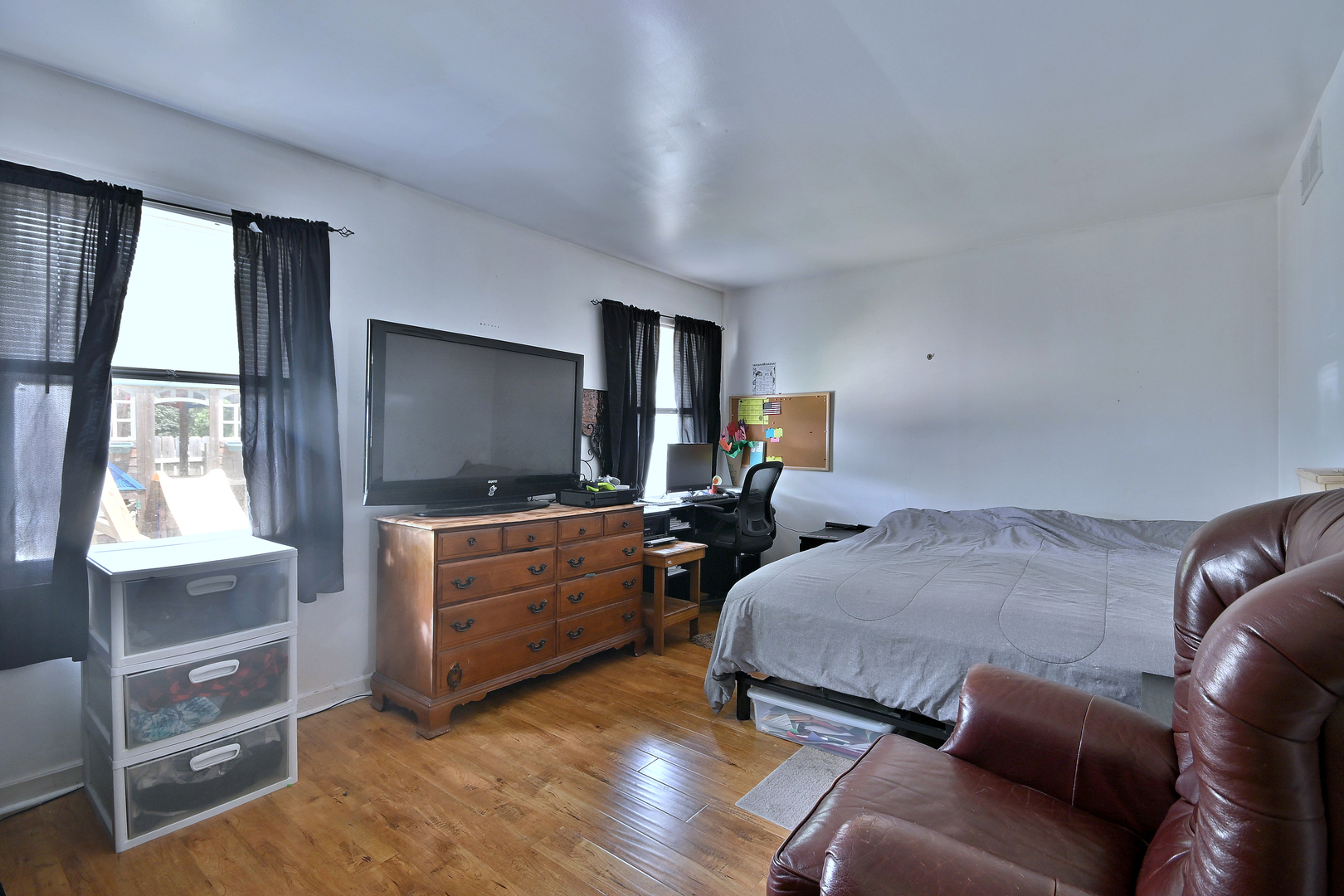 518 Emerson Circle Bolingbrook, IL 60440 - Photo 23 of 29 a bedroom with furniture and a flat screen tv