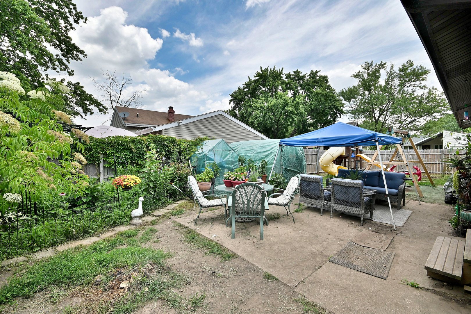 518 Emerson Circle Bolingbrook, IL 60440 - Photo 26 of 29 a backyard of a house with barbeque oven table and chairs