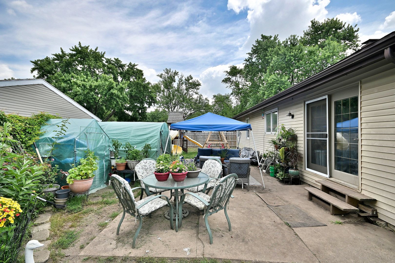 518 Emerson Circle Bolingbrook, IL 60440 - Photo 27 of 29 a patio with a table and chairs under an umbrella