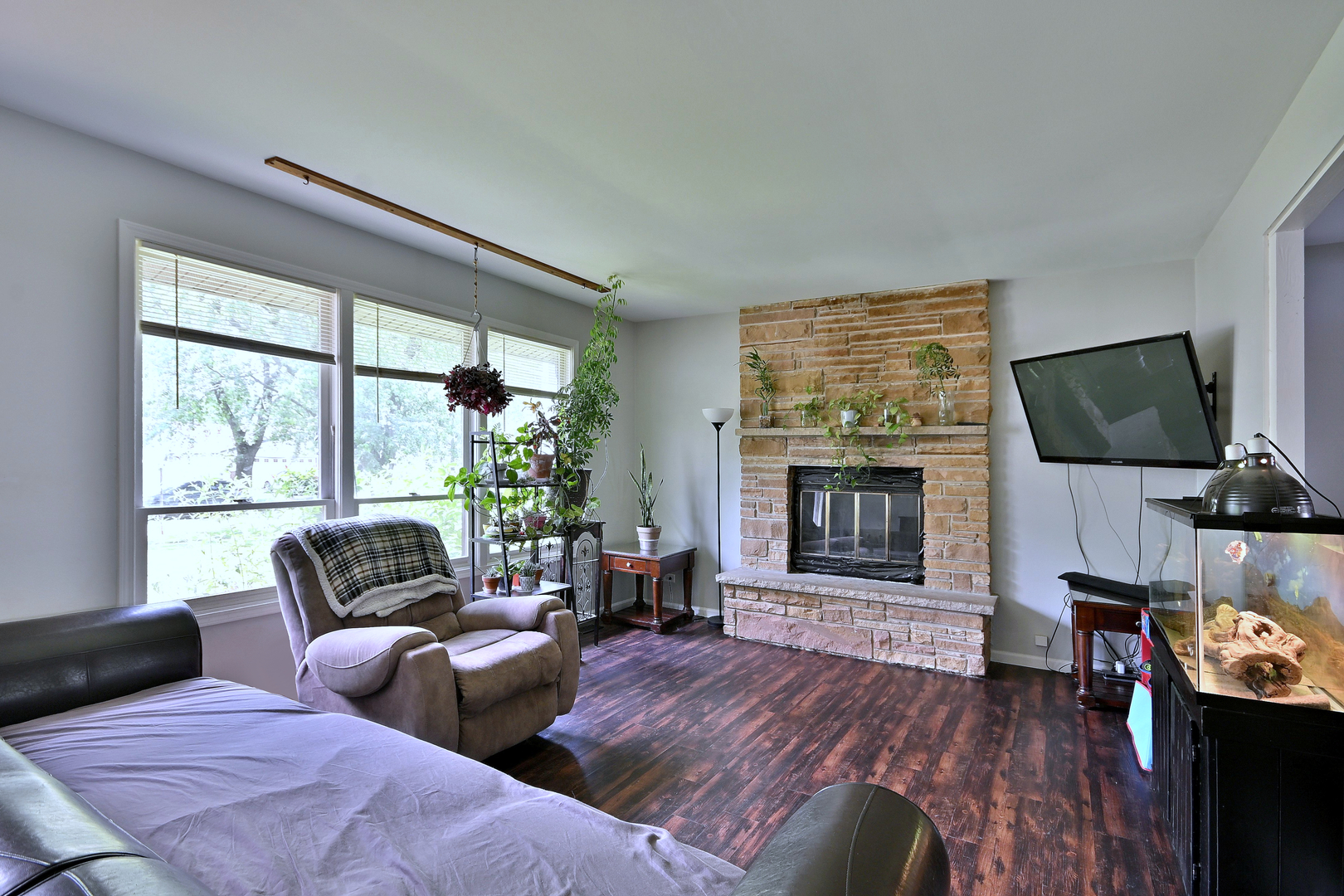 518 Emerson Circle Bolingbrook, IL 60440 - Photo 6 of 29 a living room with furniture a flat screen tv and a fireplace