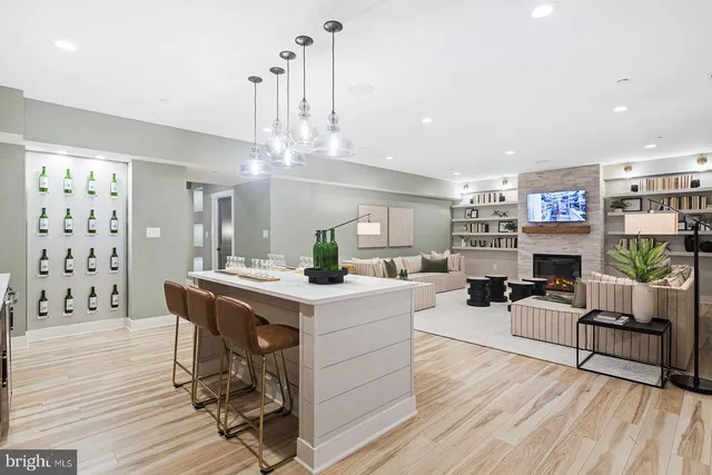 a kitchen with a sink cabinets and wooden floor