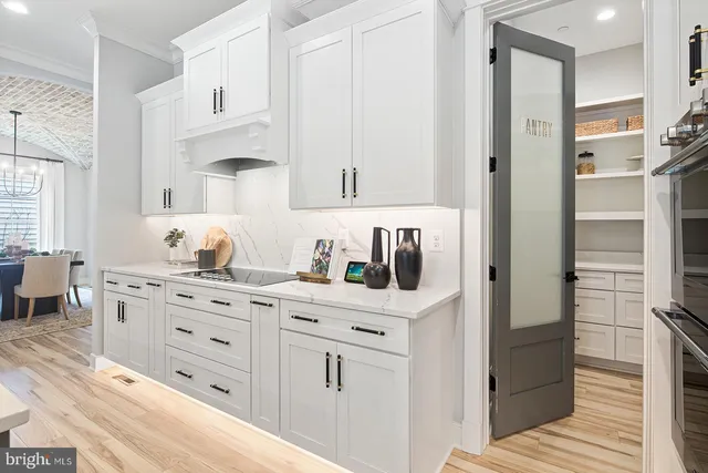 a kitchen with stainless steel appliances and refrigerator