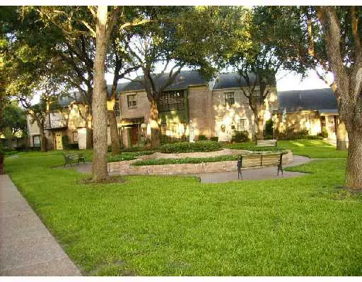 a swimming pool with outdoor seating and yard