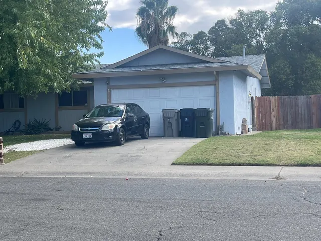 a car parked in front of a house