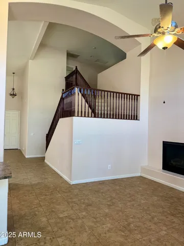 a view of an empty room with a fireplace
